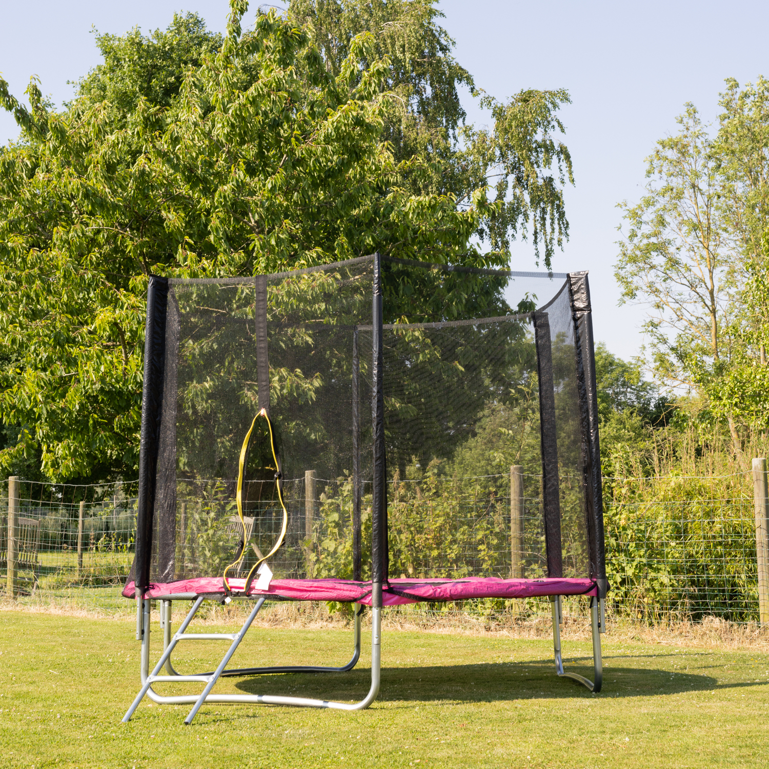 Cama elástica de 245cm reversible rosa/gris, Pack trampolín CANBERRA + red de seguridad + escalera + lona + kit de anclaje.